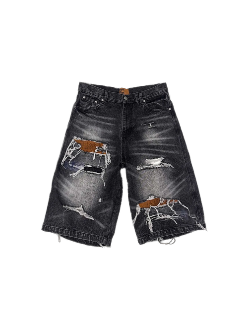 Distressed black Birth of Royal Child jorts with exposed brown lining — image 1