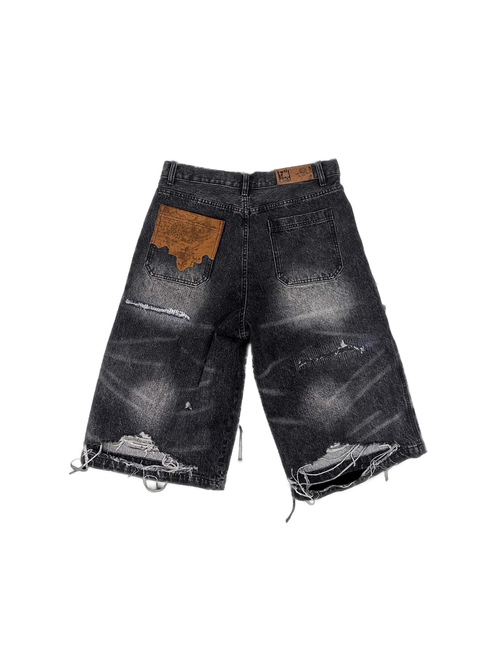 Distressed black Birth of Royal Child jorts with exposed brown lining — image 2
