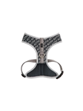 Front view of black-and-white Kith for wagwear padded pet harness with gray mesh padding, straps, and buckles