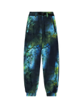 Y-3 trousers with dark blue and green forest print, elastic cuffs, and black drawstring waist